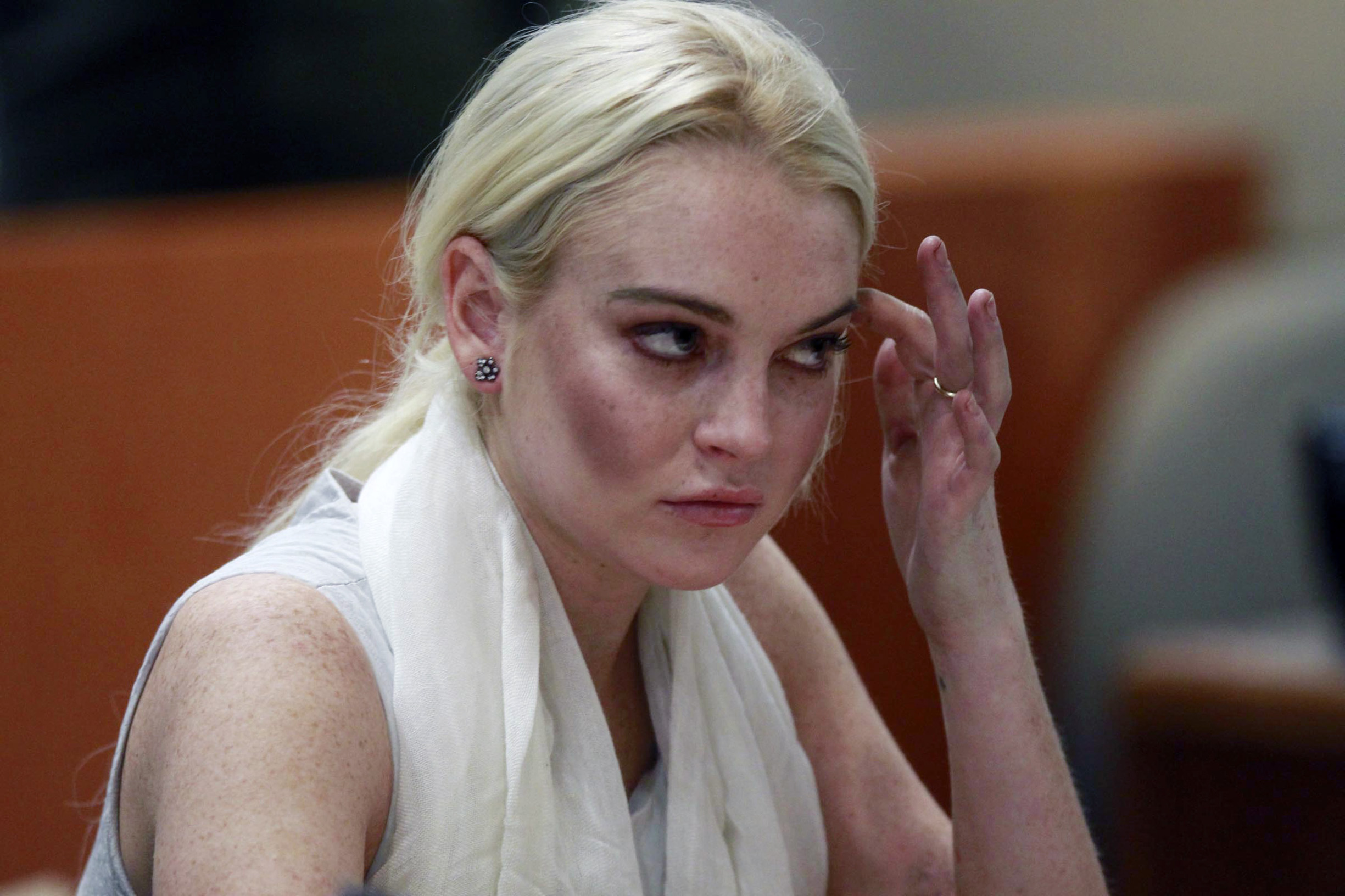 Actress Lindsay Lohan listens as a judge revokes her probation for failing to appear at a series of community service appointments at the Los Angeles Superior Court Airport Branch Courthouse during a progress report hearing in Los Angeles on October 19, 2011., Image: 105054848, License: Rights-managed, Restrictions: , Model Release: no, Credit line: MARK BOSTER / UPI / Profimedia